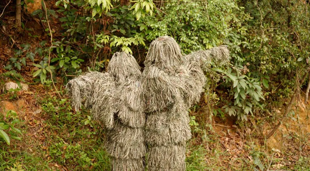 two hunters in Ghillie suits