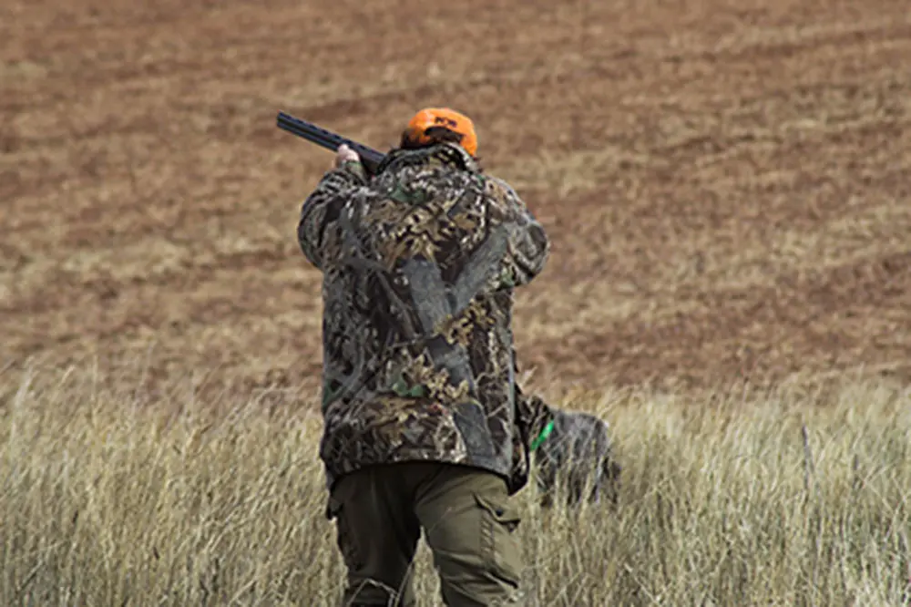 A hunter is pinpointing a target over a long distance
