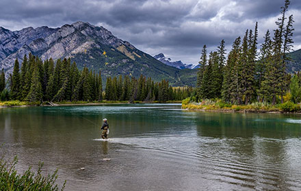 An angler is fishing outdoors