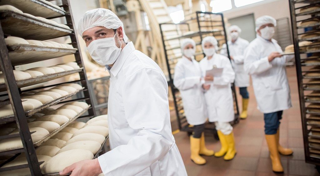 workers wear butcher rain boots in workplace