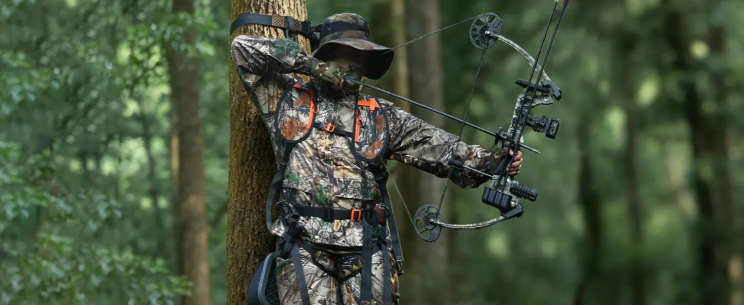 Hunter wearing a tree stand safety harness while hunting from a tree