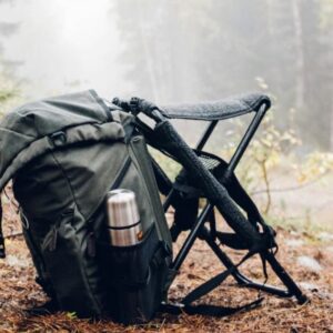 a a backpack and a chair ready for turkey hunting