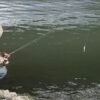 a fisherman is fishing in Wisconsin lake