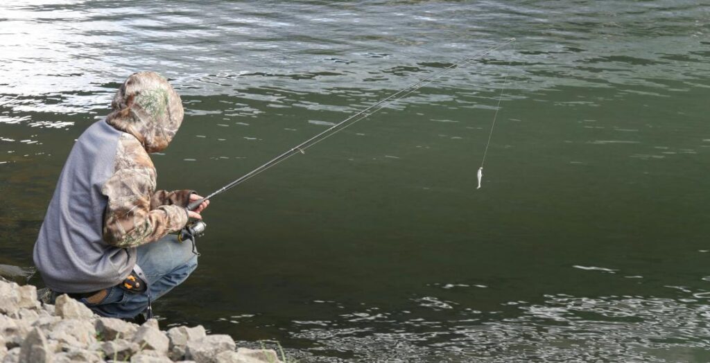 a fisherman is fishing in Wisconsin lake
