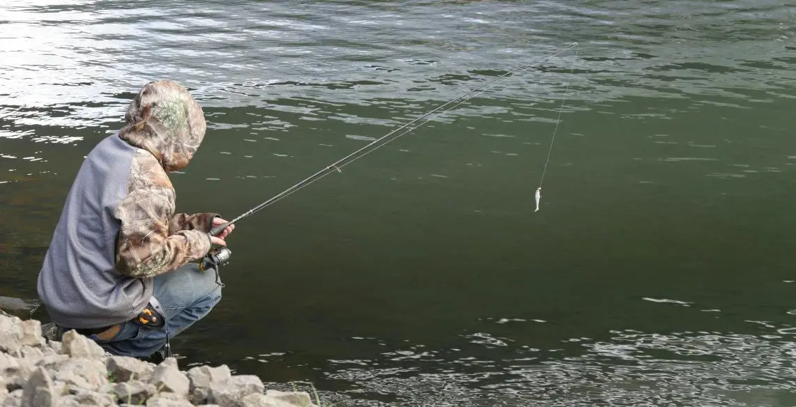 a fisherman is fishing in Wisconsin lake