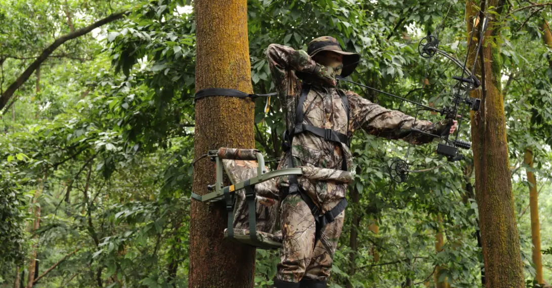 wear safety harness and rope for safety when using climbing tree stand