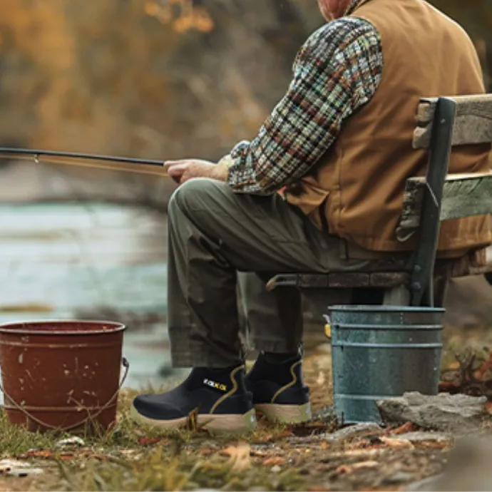 a man is wearing kalkal sport deck boots and fishing in the lake
