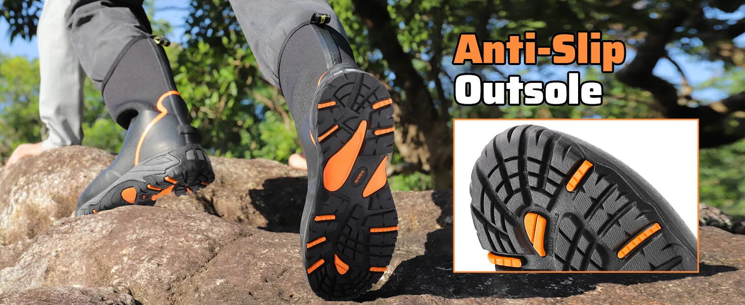 a man wears the Kalkal slip resistant rubber boots on rocky terrain