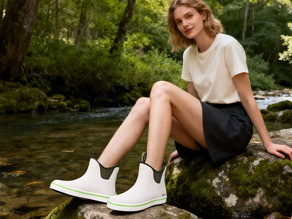 Female walking through a stream in waterproof women’s boots