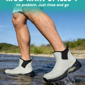 A person stepping in deep water to demonstrate the 100% waterproof feature of Kalkal men's rubber boots