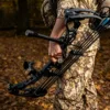 a hunter is holding his bow, ready for a turkey hunting trip