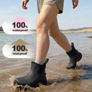 Woman wearing waterproof rubber boots walking through shallow water
