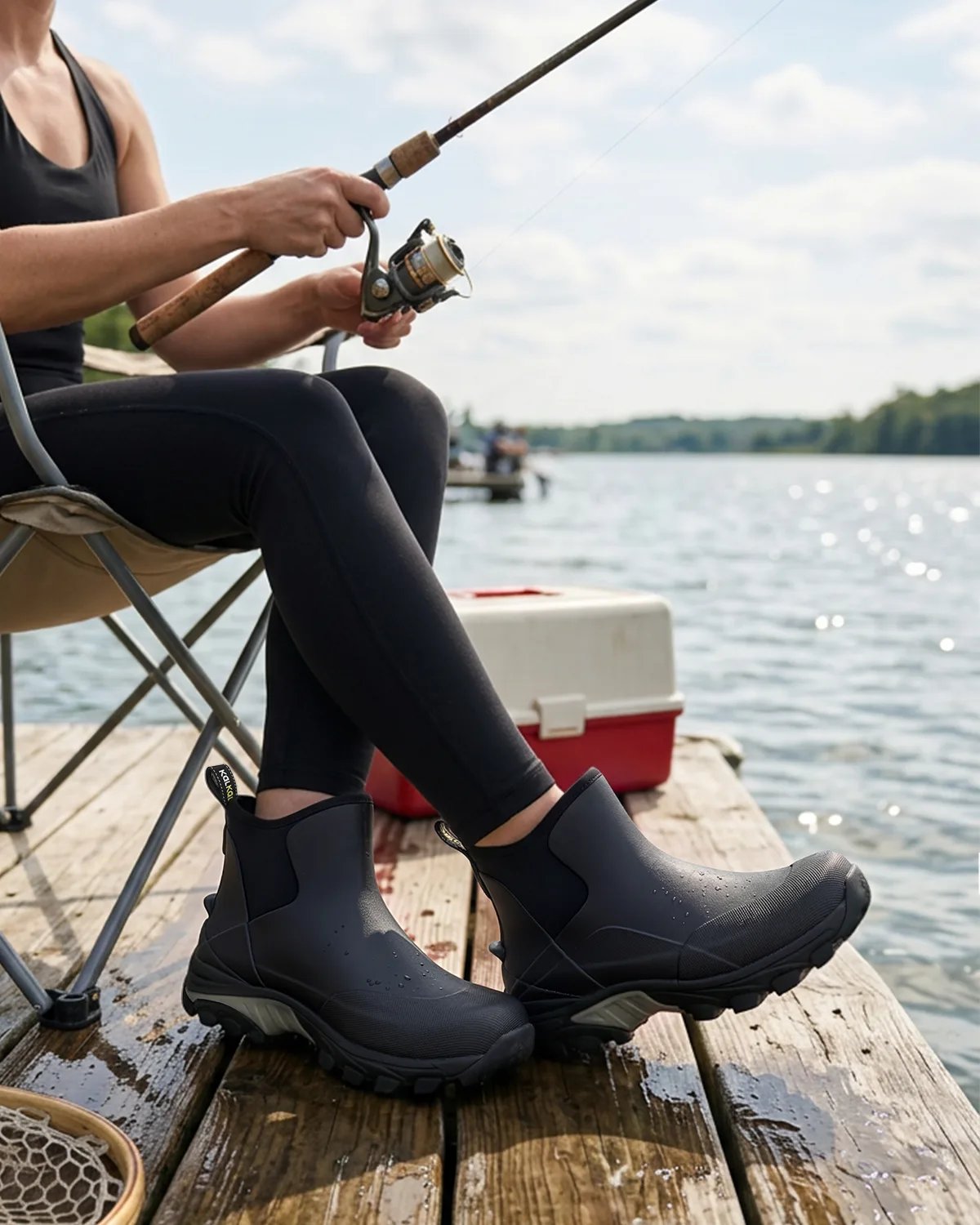 womens ankle deco boots for fishing Woman wearing Kalkal women's fishing boots while fishing on a dock