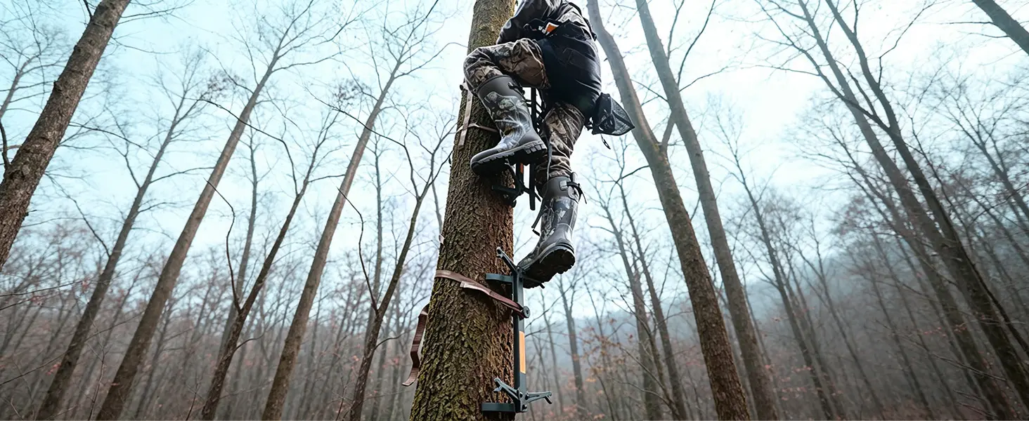 Hunter climbing with folding sticks during a mobile hunting setup
